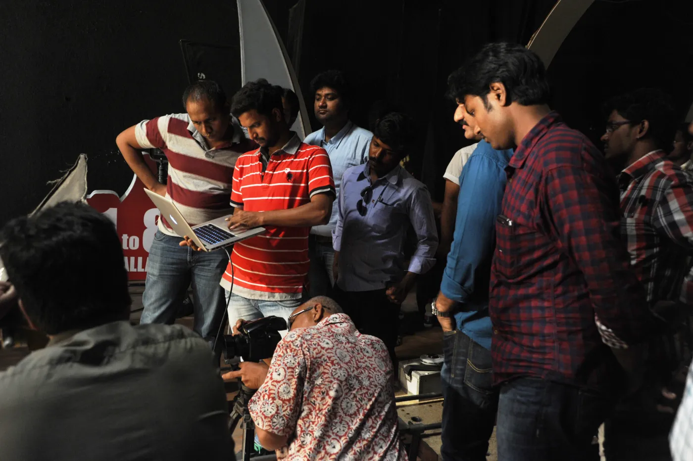 Production crew reviewing a shot on a director's monitor